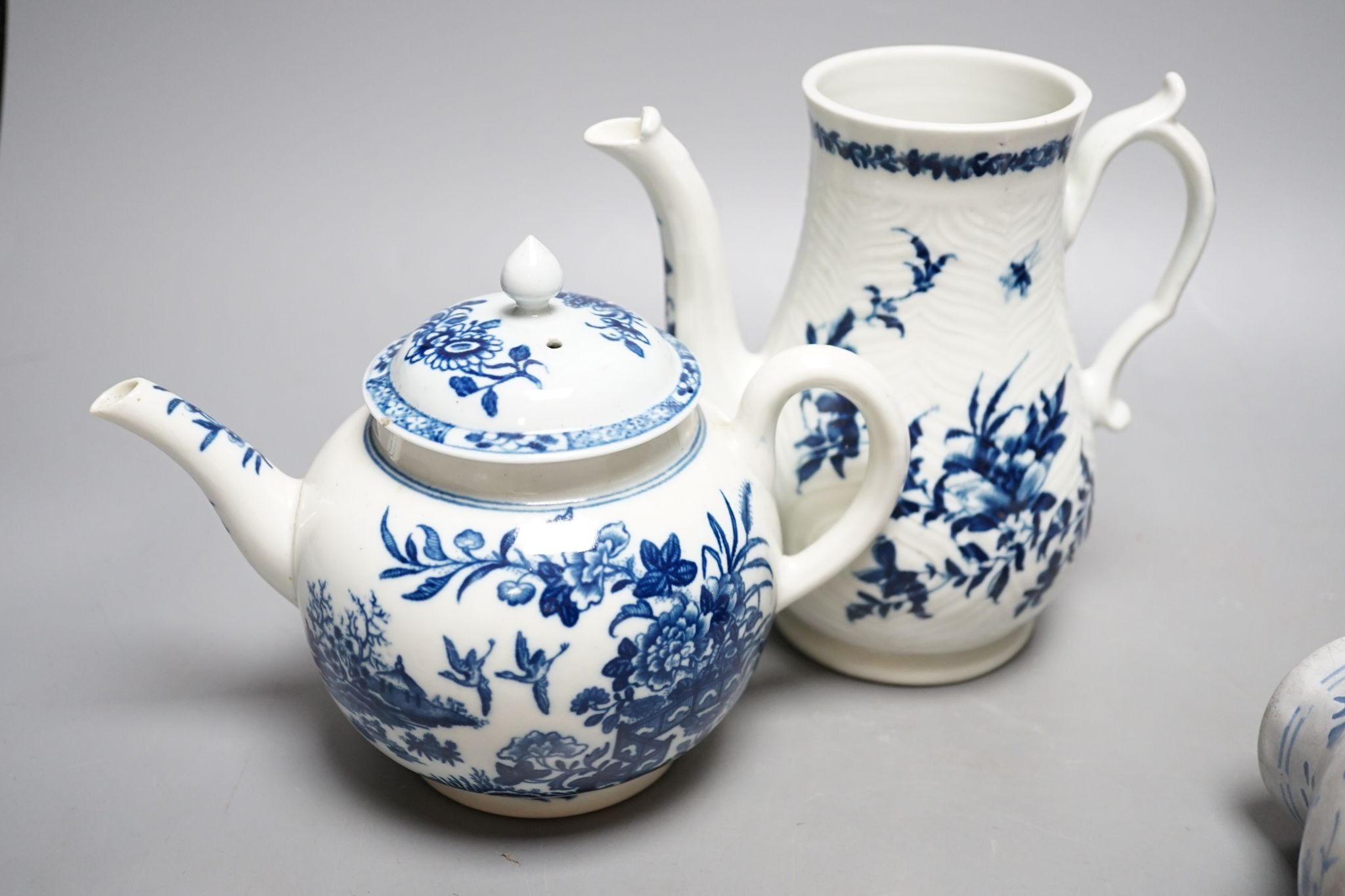 Two Worcester teapots, a delft jug, sparrow beak jug and another, tallest 16cm